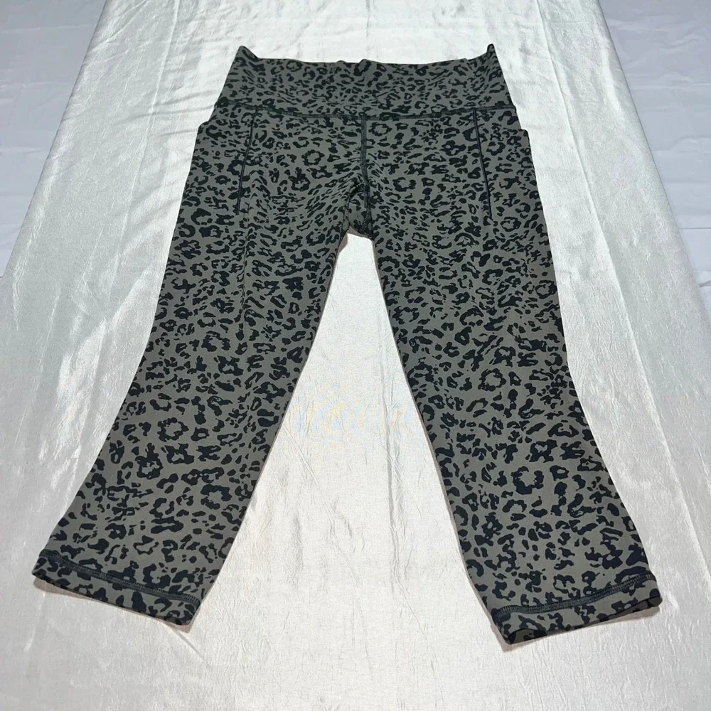 Athleta Salutation II Capri Leggings Olive Green Leopard Print Pockets Womens M